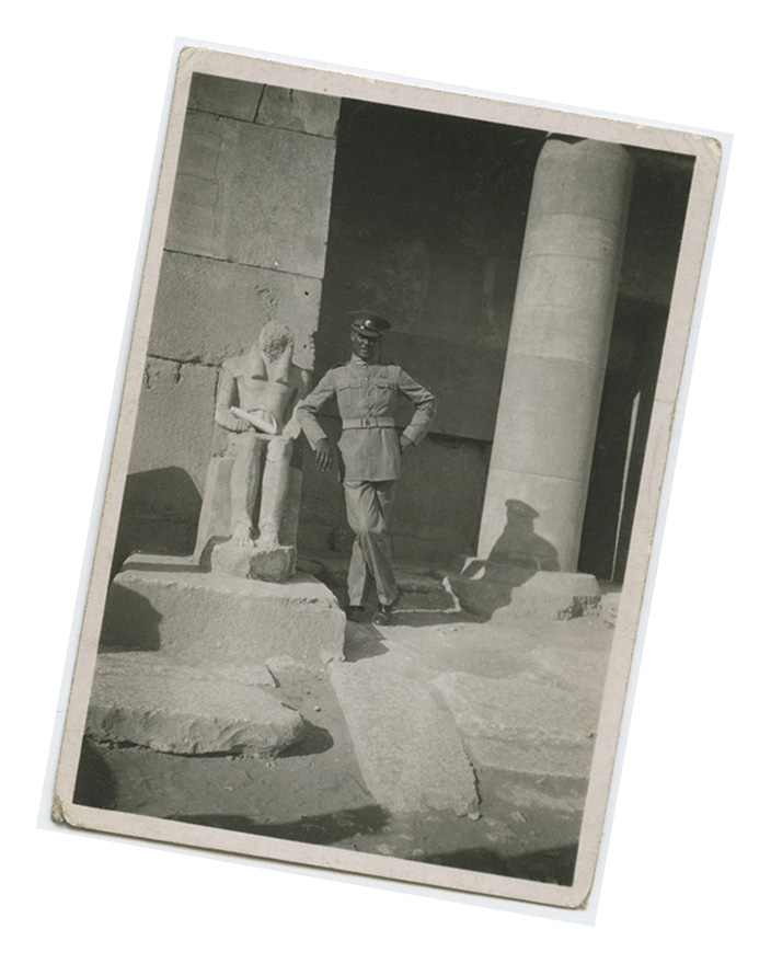 My father in uniform leaning on an ancient statue, Egypt, c.1939