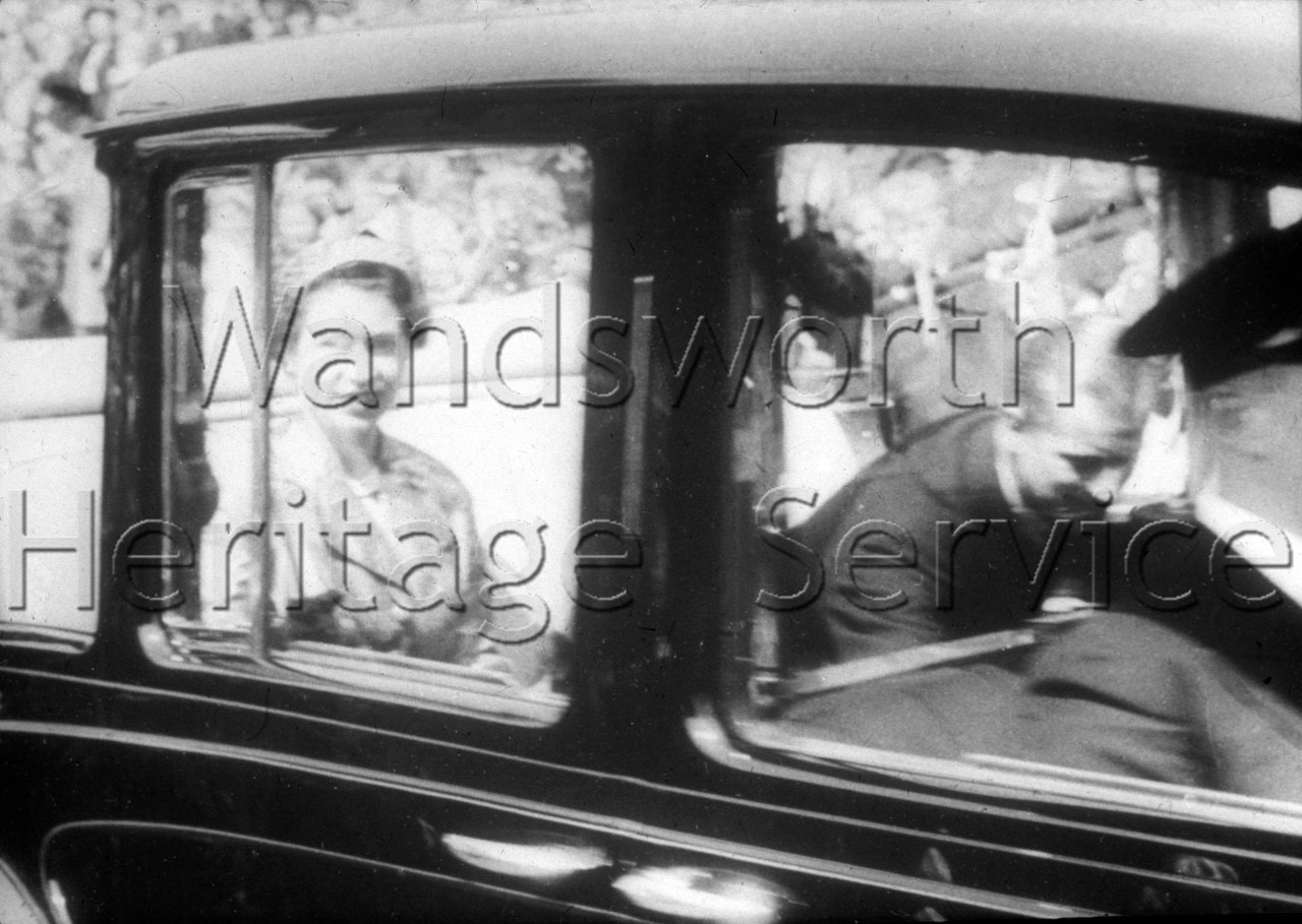 The Queen and Prince Philip seen through the car window, 9 June 1953