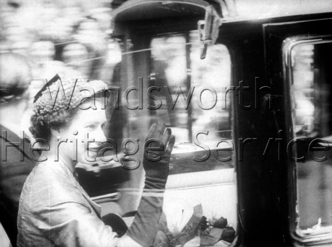Close-up of Queen Elizabeth waving from her car, 9 June 1953